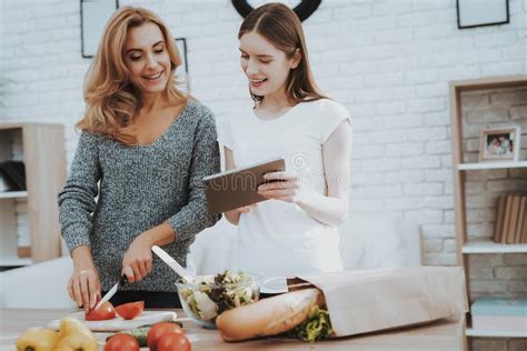 mom and daughter are cooking together in the kitchen stock image image of mother love 105710249