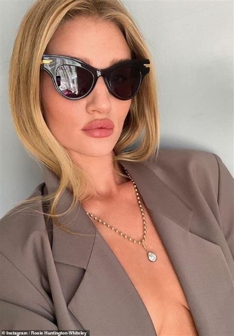 rosie huntington whiteley poses braless in a plunging blazer as she