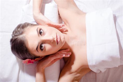 relaxed beautiful woman lying on her back and looking at