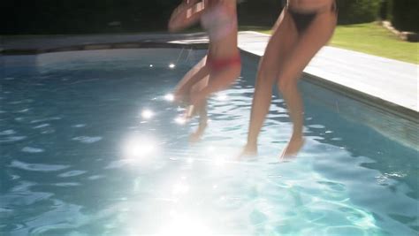 Mother And Daughter Jumping Into Stock Footage Video 100