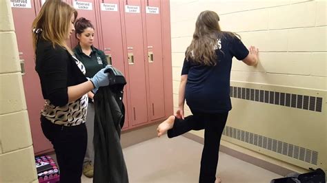 girl being strip searched in jail