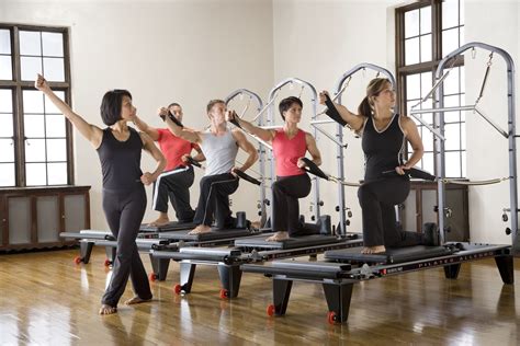 group  people   gym  pivots  exercise equipment
