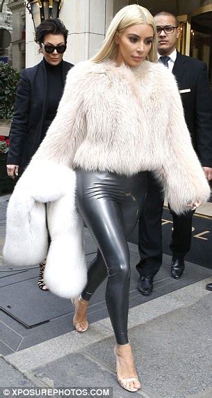 kim kardashian squeezes her curvy assets into pewter latex