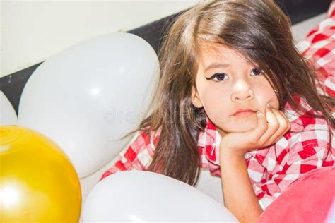 Long Haired Girl In Red Plaid Shirt Make Up Her Lips Look Innocent