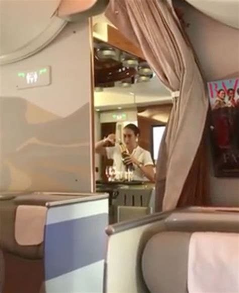 Emirates Air Hostess Caught On Video Pouring Champagne Back Into Bottle