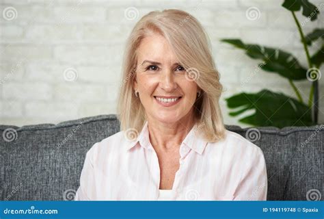 portrait of a senior woman mature smiling lady feeling happy stock
