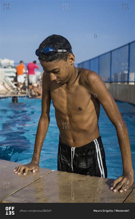 teenage boy    swimming pool stock photo offset