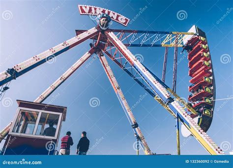 side view  viking funfair ride  amusement park  clear blue sky editorial photography