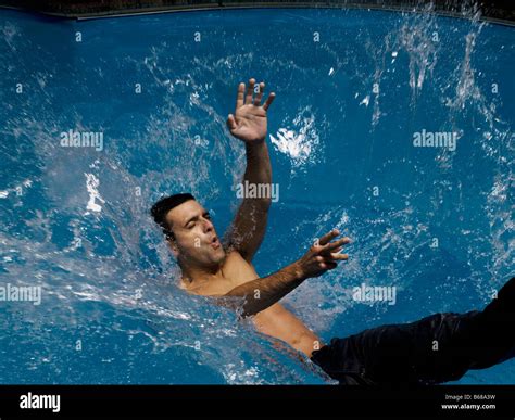 man falling  water slow motion stock photo royalty  image