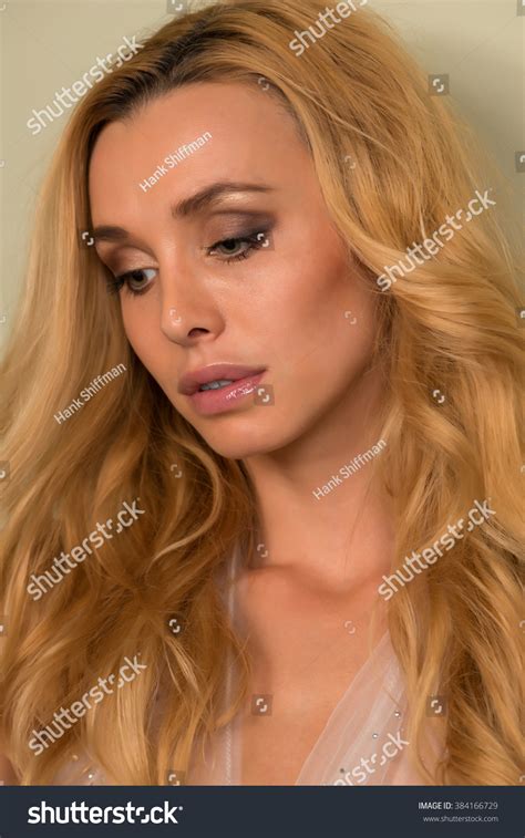 Beautiful Slender Czech Blonde In A Sheer Nightgown 写真素材 384166729