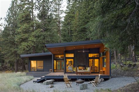 large windows  glazed doors   modern cabin mingle  nature