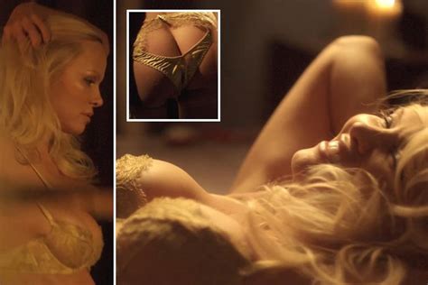 pamela anderson strips nearly naked and writhes in ecstasy as she pleasures herself on a bed of