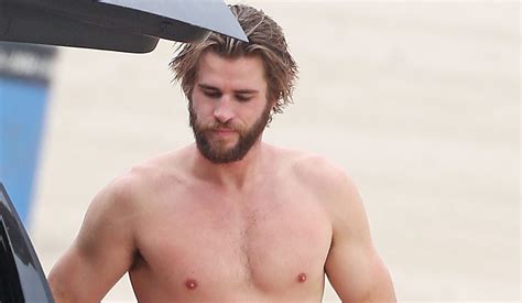 Liam Hemsworth Goes Shirtless While Surfing In Malibu