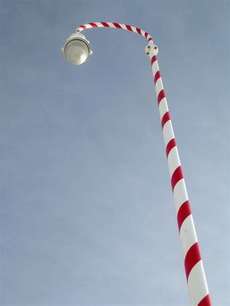 candy cane pole wraps turn  downtown   north pole santa