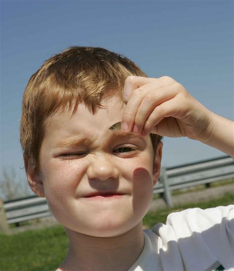 fileclose   face  young boy holds  small fishjpg