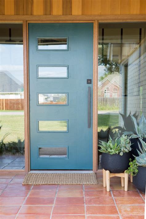 white midcentury modern exterior  blue front door hgtv