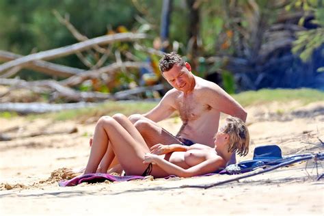 busty lara bingle tanning nude on a beach in hawaii pichunter