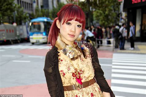stylish japanese girl with red hair in shibuya