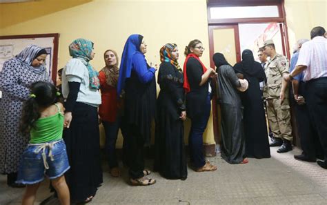 egyptians wait to cast their vote inside a polling station in cairo on the second day of egypt s