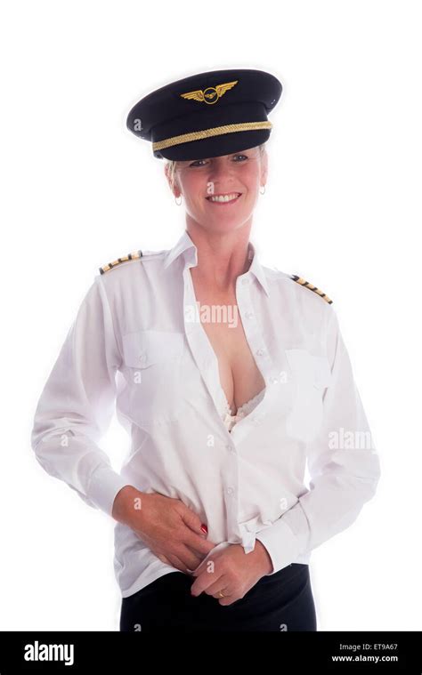 Attractive Female Airline Pilot Getting Dressed Tucking In Her Uniform
