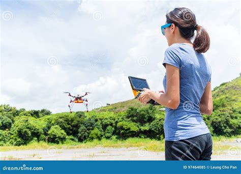 woman controlling flying drone stock image image  digital lifestyle