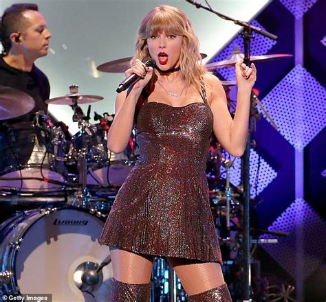 taylor swift sparkles in a short dress and thigh high