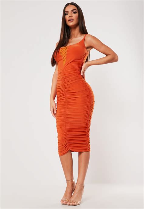 sxf x missguided orange slinky ruched lace up midi dress missguided