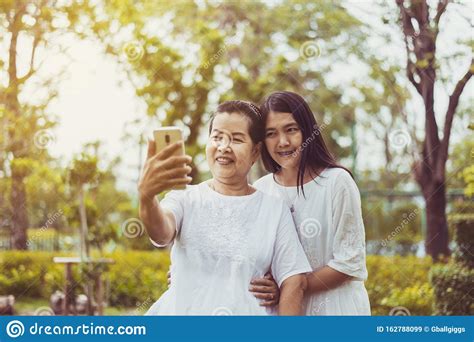 Middle Asian Woman Selfie With Mobile Phone Daughter Take