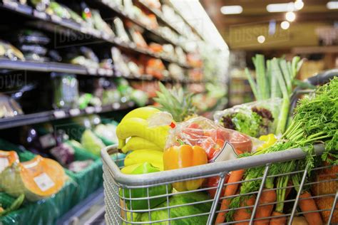 close   full shopping cart  grocery store stock photo dissolve