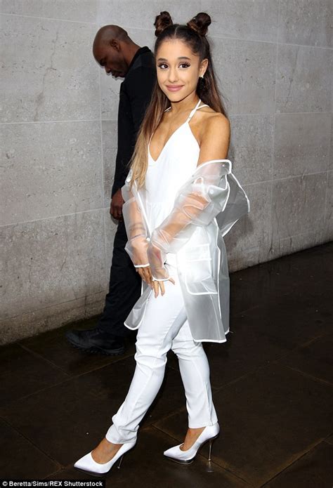 ariana grande covers up in chic white jumpsuit for radio 1 appearance