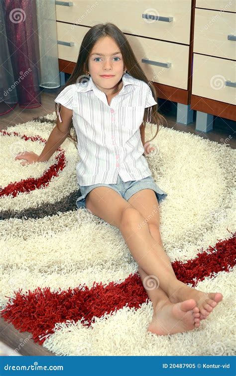 girl sitting   carpet royalty  stock photo image
