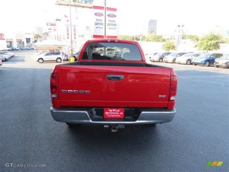 flame red dodge ram  slt quad cab  photo