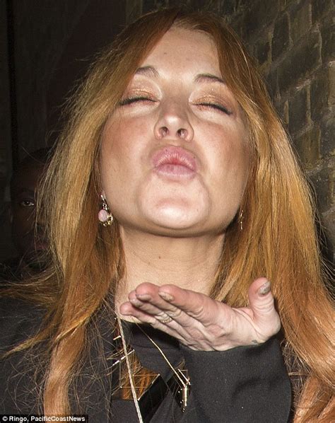 lindsay lohan blows kisses leaving chiltern firehouse in kinky boots