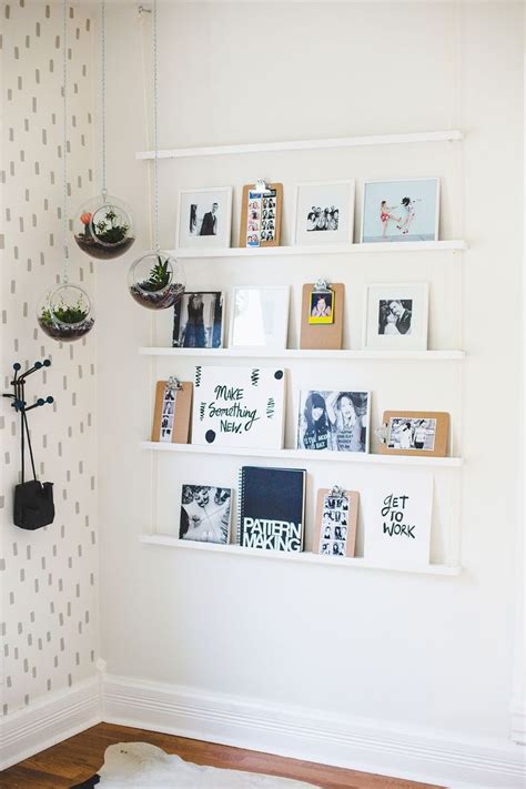 unique ways  hang pictures   wall stylecaster