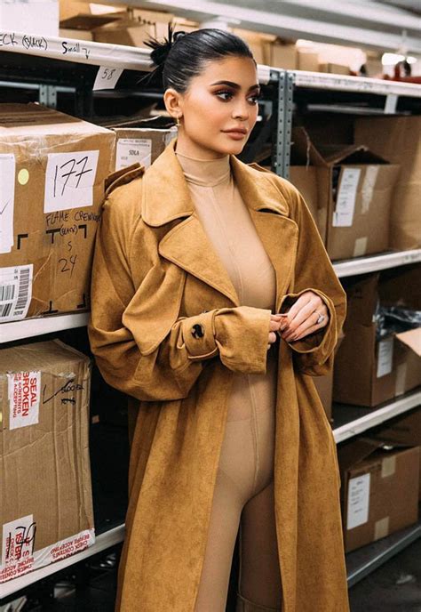 kylie jenner sparks camel toe chaos as coat parts over sheer bodysuit