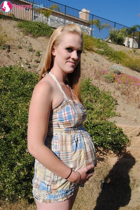 pregnant blonde in cute plaid poses her luscious tits and