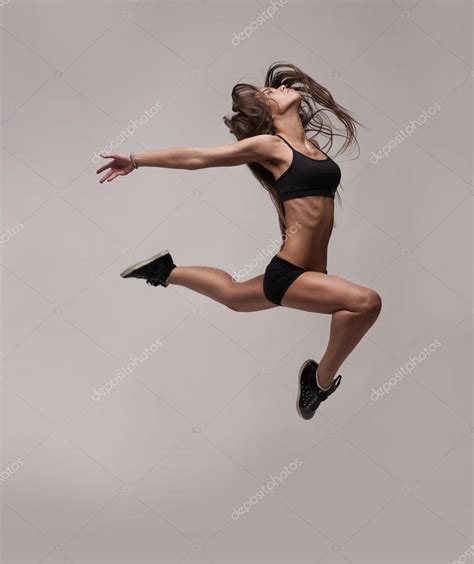 caucasian fitness woman jumping stock photo  doodko