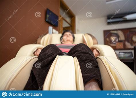 A Senior Woman Lies On A Massage Chair In Her Apartment She Really