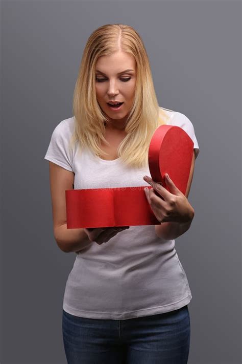Young Blonde Girl With T In Hand Red In The Shape Of A Heart