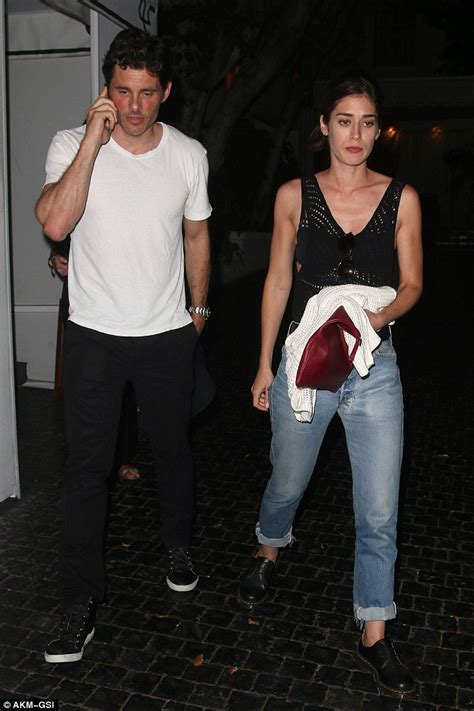 lizzy caplan gives james marsden a friendly kiss at chateau marmont