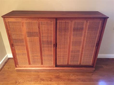 mid century walnut cabinet  rattan door panels  epoch