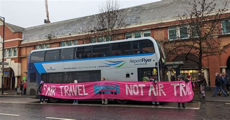 extinction rebellion activists surround bristol airport bus  transport protest bristol