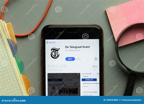 york usa  october  de telegraaf krant mobile app logo  phone screen close