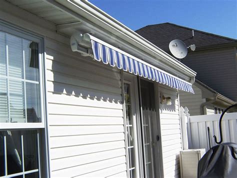 retractable blue estate awning    soffit mount house awning homeowner