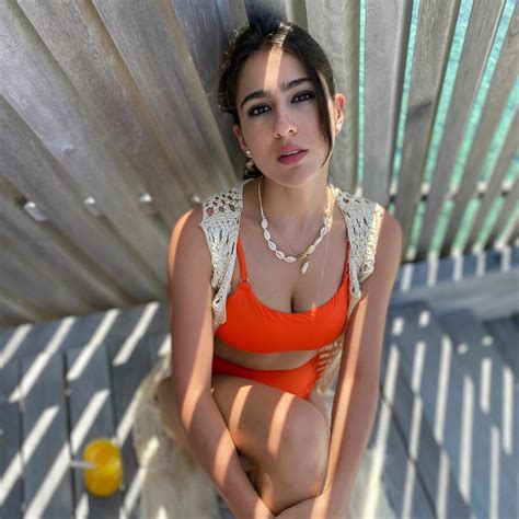 sara ali khan dons tangerine bikini  flaunt  toned body