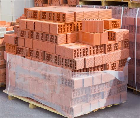 wall ceramic perforated blocks  red bricks   pallet stock photo