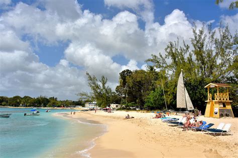 People Enjoying Holetown Beach In Barbados Encircle Photos