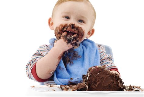 messy baby eating  chocolate cake odea marketing odea