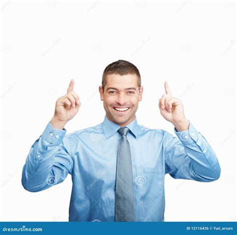 smiling man pointing   copyspace  white stock photo image