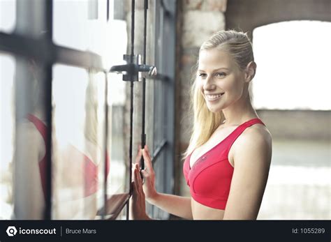 Free Smiling Woman In Red Brassiere Near Glass Window Photo Download In